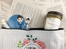 Load image into Gallery viewer, Jane Austen themed gift set featuring pocket mirror, laminated magnetic bookmark, limoncello lip balm, Pemberly gardens candle, and zip up pouch
