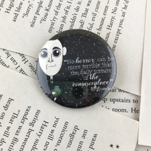 Load image into Gallery viewer, HP Lovecraft pinback button or magnet with quote &quot;no horror can be more terrible than the daily torture of the commonplace&quot;