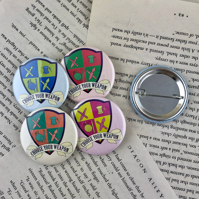set of four creative crest pin back buttons reading 