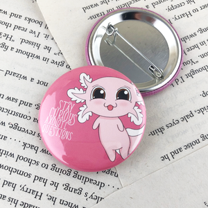 kawaii cute pink axolot pinkback button reading "stay curios axolotl questions"