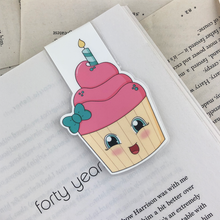 Load image into Gallery viewer, laminated magnetic bookmark featuring a pink cupcake with a green bow and a birthday candle