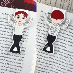 Kawaii cute laminated magnetic bookmark features red haired male ballerina with words "life is the dancer, you are the dance" on back